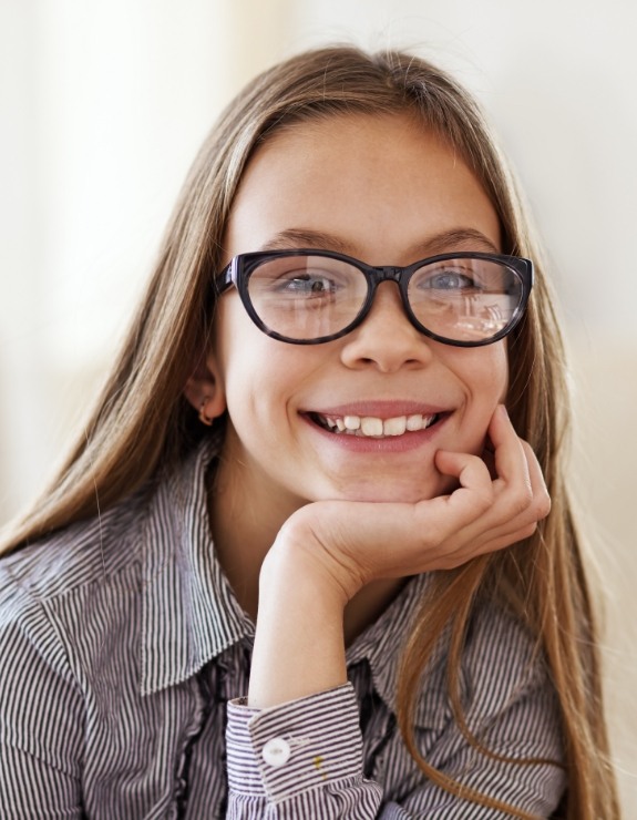 Smiling young girl with glasses