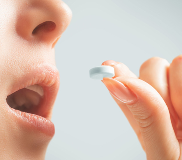 Person taking a pill