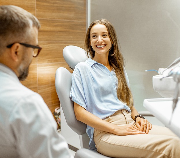 Patient smiles at dentist