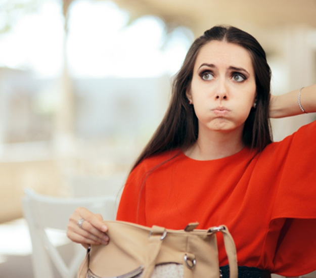 Woman searching through her purse for lost item