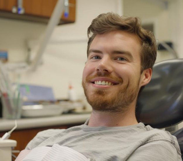 Smiling, relaxed man in dental treatment chair