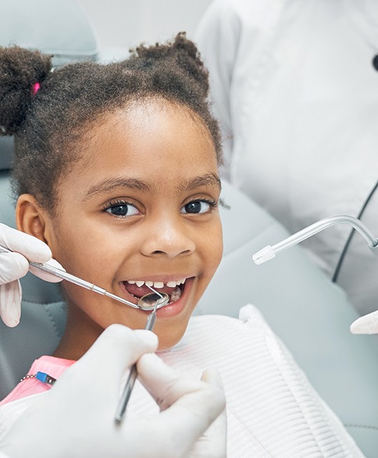 Little girl preparing to receive dental sealants in Arlington Heights